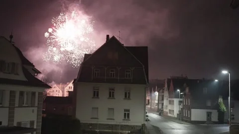 Shining Night City Under Sparkling Fireworks, City Illuminates Peacefully Amid Video stock 325536582