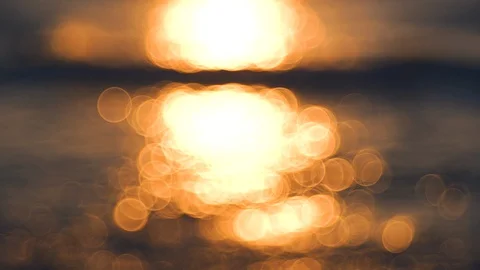 Shining ocean waves, golden sea sunrise and glowing water. Abstract background Stock Footage