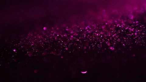 Shining pink particles in motion over dark background Stock Footage 171511084