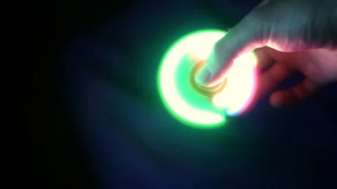 Shining spinner in black background Stock Footage 78186817