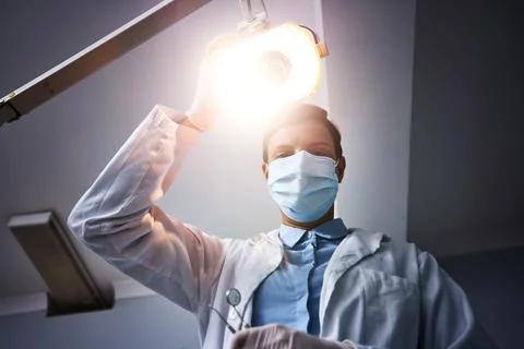 Shining the spotlight on dental health. Low angle shot of a dentist getting Stock Photos