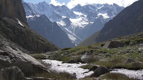 Shining water streams in a mountain river Video stock 77247300