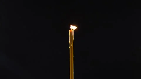 Shining wax candle on the dark. Stock Footage 158332207