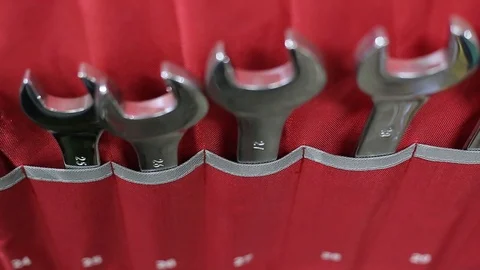 Shining wrenches in case hanging on the wall inside car and motorcycle workshop Stock Footage 125747858