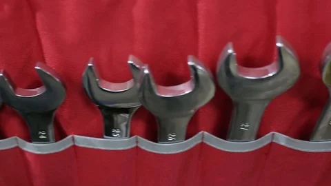 Shining wrenches in case hanging on the wall inside car and motorcycle workshop Stock Footage 125747882