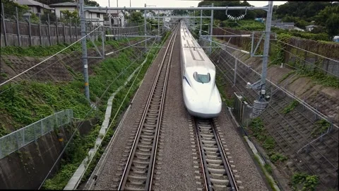 Shinkansen, bullet train, passes under the railway overpass at full speed Stock Footage 138868966