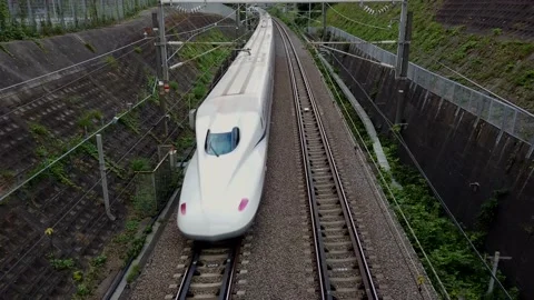 Shinkansen, bullet train, passes under the railway overpass at full speed Stock Footage 138869029
