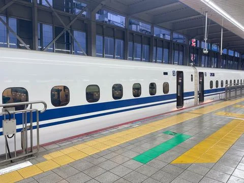 Shinkansen bullet train side view at Japanese station Stock Photos