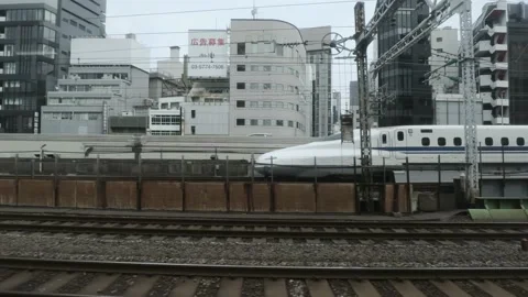 Shinkansen is moving on the track during the day in Tokyo, Japan Stock Footage 205551692