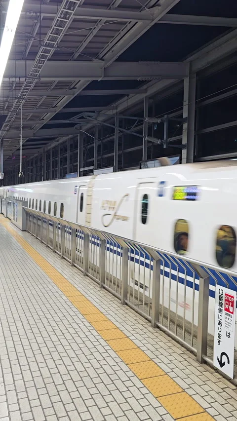 Shinkansen N700 series bullet train waiting at platform in Osaka station, Japan Stock Footage 328651184
