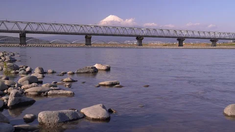 Shinkansen, Or Bullet Train, Passing By On Fujikawa Bridge In Japan Near Stock Footage 128503136