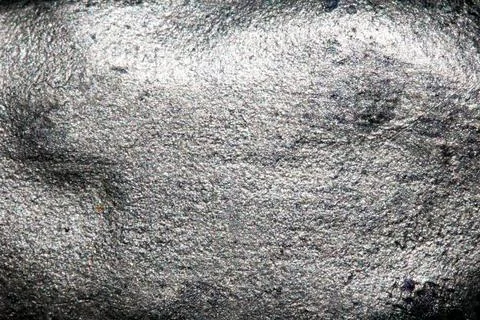 A shiny background with dimples and slightly textured made from mica powder.. Stock Photos