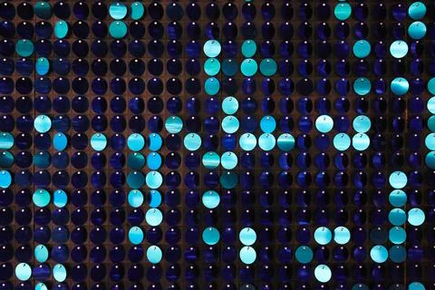 Shiny background texture, a set of round blue sequins like fish scales Stock Photos