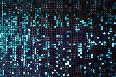 Shiny background texture, a set of round blue sequins like fish scales Foto stock