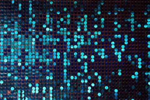 Shiny background texture, a set of round blue sequins like fish scales Stock Photos