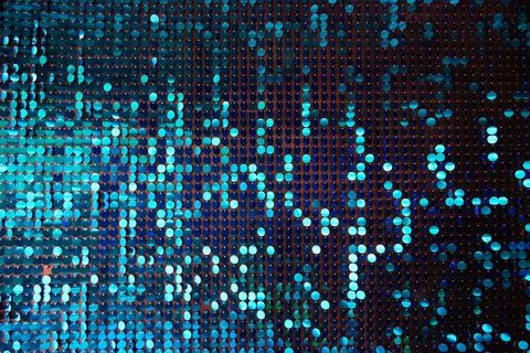 Shiny background texture, a set of round blue sequins like fish scales Stock Photos