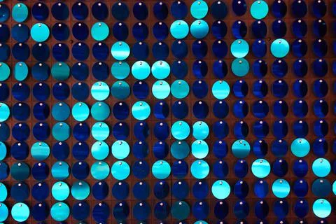 Shiny background texture, a set of round blue sequins like fish scales Stock Photos