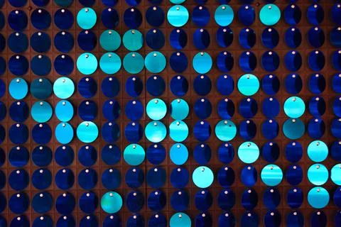 Shiny background texture, a set of round blue sequins like fish scales Stock Photos