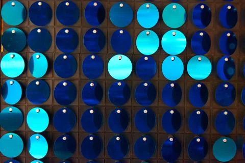 Shiny background texture, a set of round blue sequins like fish scales Stock Photos