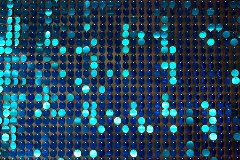 Shiny background texture, a set of round blue sequins like fish scales Stock Photos