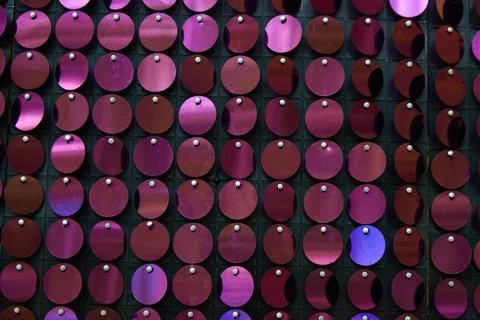 Shiny background texture, a set of round purple sequins like fish scales Stock Photos