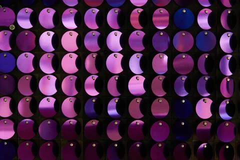 Shiny background texture, a set of round purple sequins like fish scales Stock Photos