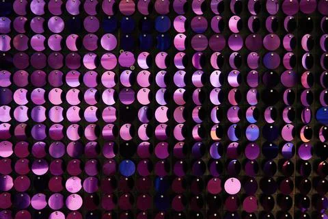 Shiny background texture, a set of round purple sequins like fish scales Stock Photos
