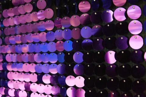 Shiny background texture, a set of round purple sequins like fish scales Stock Photos