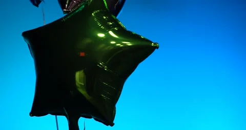 Shiny Balloons Floating On Stage Bright Background Rack Focuses and Tilts 4K Stock Footage 231144491