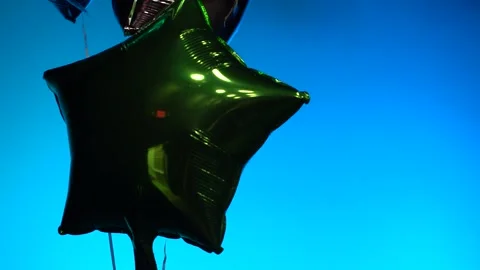 Shiny Balloons Floating On Stage Bright Background Rack Focuses and Tilts 1080 Stock Footage 231146985