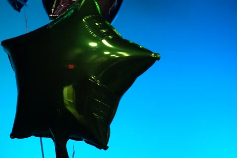 Shiny Balloons Floating On Stage Bright Background Rack Focuses and Tilts 720 Stock Footage 231173464