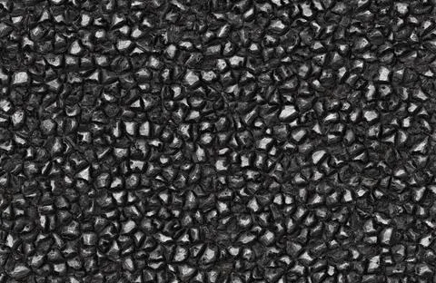 Shiny black coal texture background with small glossy rock fragments and mineral Stock Illustration