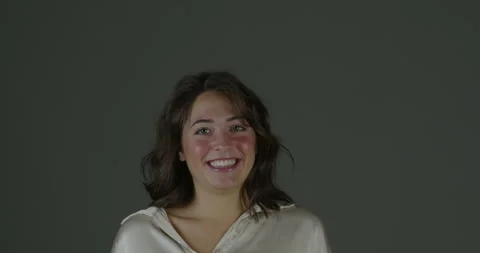 Shiny blouse, rosy cheeks on neutral background Stock Footage 270627241