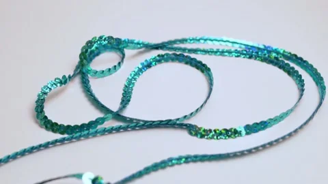 Shiny Blue Sequins on a White Background, Close-up. Background of Beautifully La Video stock 166092272