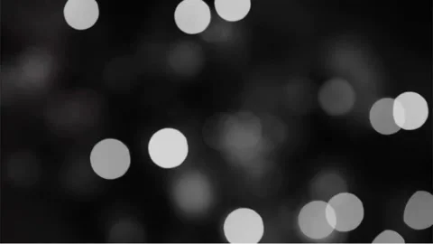 Shiny blurry circle lights on black background Stock Footage 237905944