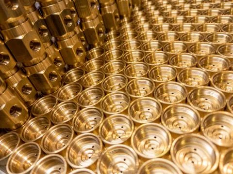 Shiny brass metal threaded hexagonal fitting parts, abstract perspective 库存照片