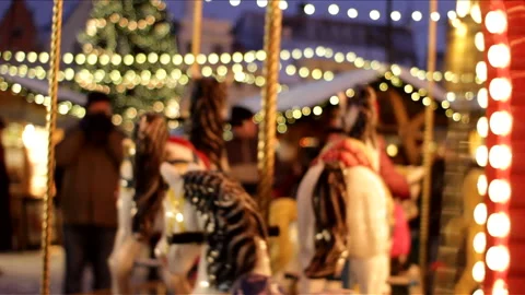 Shiny carousel with out of focus children Stock Footage 233472894