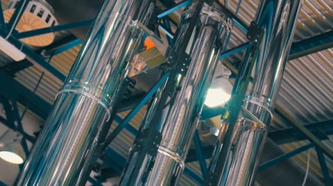Shiny chrome ventilation pipes in a large hangar Stock Footage 60228043