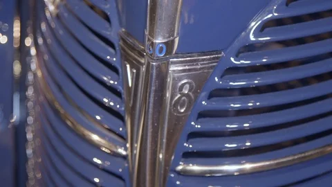 Shiny chromed and painted front radiator grill of classic luxury car. The Stock Footage 124696087