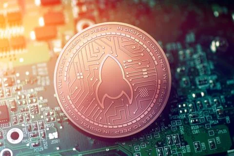 Shiny copper ROCKETPOOL cryptocurrency coin on blurry motherboard background Stock Illustration