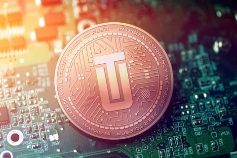 Shiny copper UTRUST cryptocurrency coin on blurry motherboard background Stock Illustration