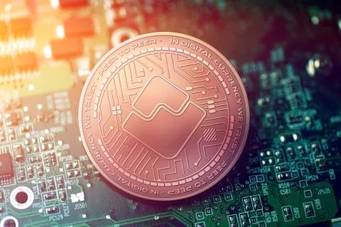 Shiny copper WAVES cryptocurrency coin on blurry motherboard background Stock-Illustration