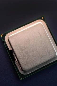The shiny cover of the computer processor. Multiple processors on a blue ba.. Stock Photos