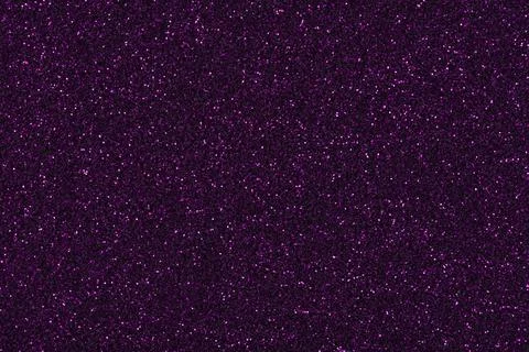 Shiny dark glitter background, texture in strict violet tone. Stock Photos