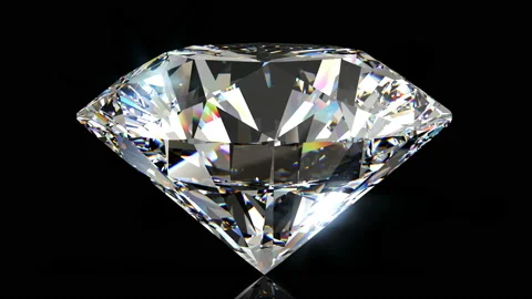 Shiny diamond rotating on a dark background. Looping animation Stock Footage 134733134