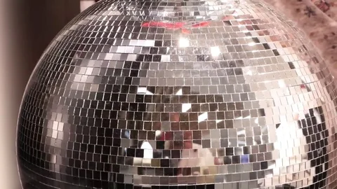 Shiny disco ball with silver reflection, close-up Stock Footage 83324175