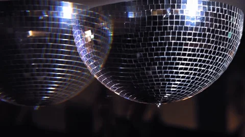 Shiny disco mirror ball turning in seamless loop. Rotating mirror disco ball