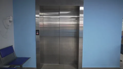 Shiny elevator doors refresh restrained reception interior 動画素材 324907141
