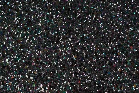 Shiny glitter texture on dark background close-up Foto stock