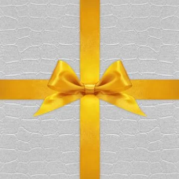Shiny golden satin ribbon bow on silver background Stock-Fotos